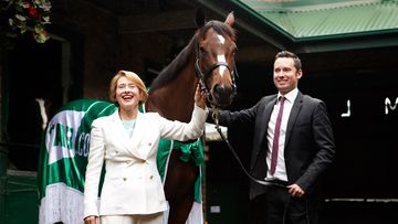 Horse trainers Gai Waterhouse and Adrian Bott pose with "English". (AAP)