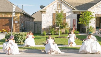 Jamie Egloff, Bryce Ellerbroek, Shannon Thomas, Nina Wagner and Jaime Sladek from Georgetown, Texas pose in their wedding dresses for fun social distancing photoshoot by neighbour Elyssa Seibel