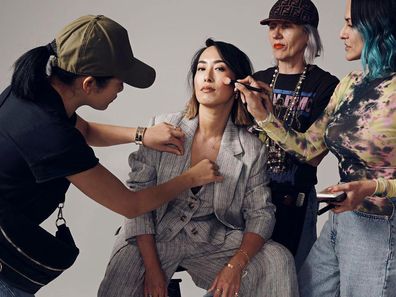 Freda Rossidis (second right) working on Melissa Leong's hair.