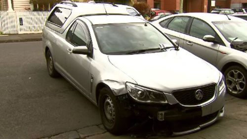 Driver on the run after ramming two police cars in Melbourne’s north, injuring an officer