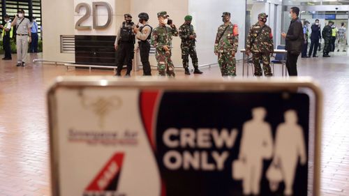 Relatives of passengers onboard missing Sriwijaya Air flight SJY182 wait for news at the Supadio airport in Pontianak on Indonesia's Borneo island on January 9, 2021, after contact with the aircraft was lost shortly after take-off from Jakarta.