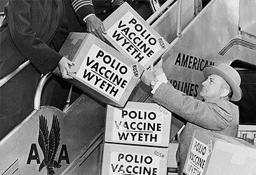 Who developed the first effective polio vaccine in 1952?
