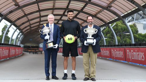 ustralian Open Tournament Director Craig Tiley, Jo-Wilfried Tsonga and Acting Sports Minister Philip Dalidakis pose for a photograph at Melbourne Park on Sunday. (AAP)
