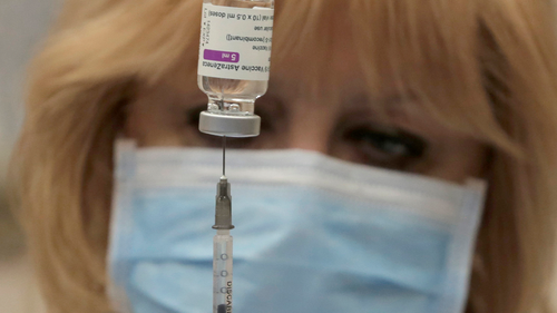 A medical worker prepares a dose of the Oxford-AstraZeneca vaccine against COVID-19 in Sofia, Bulgaria Sunday, Feb. 7, 2021.  (AP Photo/Valentina Petrova)