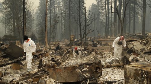 the death toll from the California wildfires has risen to at least 51 as authorities comb the blackened landscape looking for the remains of anyone who died in the disaster.