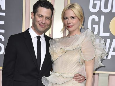 Thomas Kail, left, and Michelle Williams arrive at the 80th annual Golden Globe Awards at the Beverly Hilton Hotel on Tuesday, Jan. 10, 2023