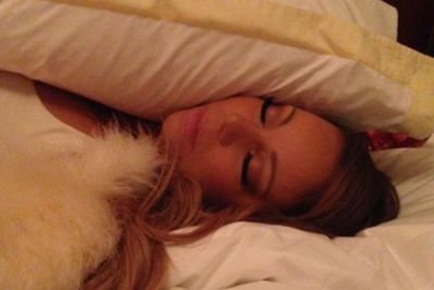 Selfies in bed, while asleep? Well, it's more like selfies in bed while pretending to be asleep. Mariah in full make-up looking like a little pop angel. No dribble? No daggy pyjamas?
