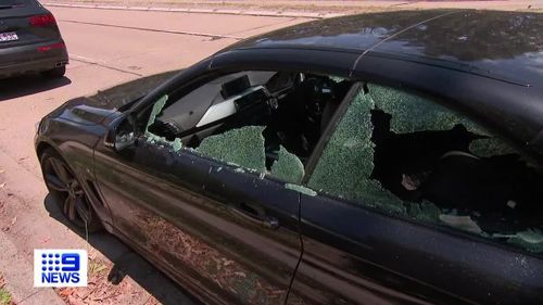 A man has been arrested after dozens of shop fronts and car windows were smashed on Sydney's Northern Beaches overnight.
