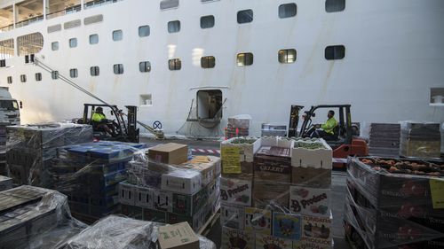 Fresh produce is loaded on to the cruise ship Pacific Explorer at Circular Quay in 2019.