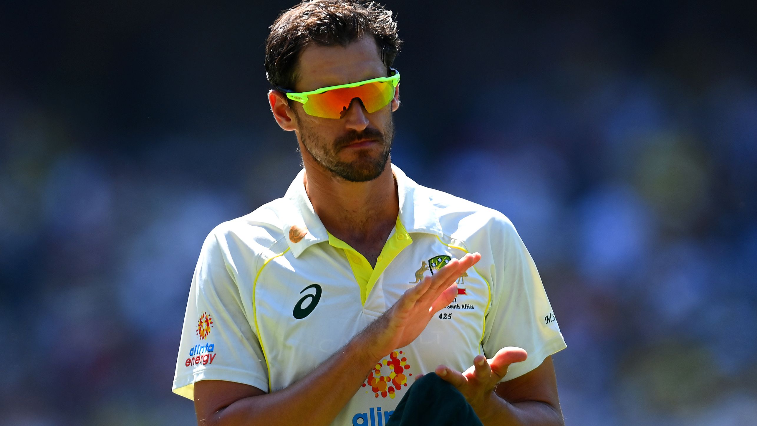 MELBOURNE, AUSTRALIA - DECEMBER 26: Mitchell Starc of Australia claps a tribute to Shane Warne during day one of the Second Test match in the series between Australia and South Africa at Melbourne Cricket Ground on December 26, 2022 in Melbourne, Australia. (Photo by Quinn Rooney/Getty Images)