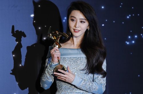 Chinese actress Fan Bingbing poses after winning the Best Actress Award of the Asian Film Awards in Hong Kong. (AAP)