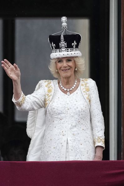 Queen Camilla waves from The Buckingham Palace balcony during the Coronation of King Charles III and Queen Camilla on May 06, 2023 in London
