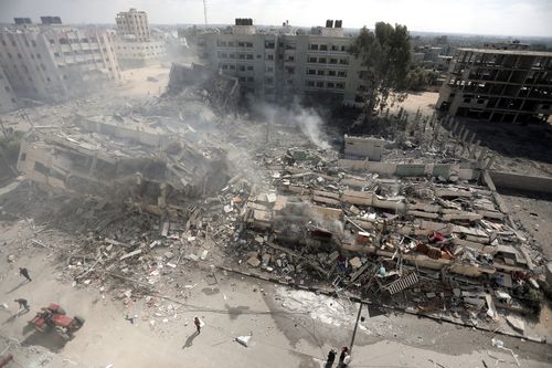 Smoke rises from destroyed buildings, following Israeli airstrikes on Gaza City, central Gaza Strip, Thursday, Oct. 19, 2023.