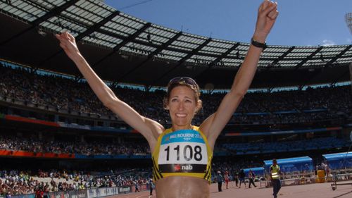 McCann celebrating winning the women's marathon in front of thousands of people. Picture: AAP