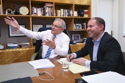 PM Morrison and new Treasurer Josh Frydenberg meet at Parliament House yesterday.