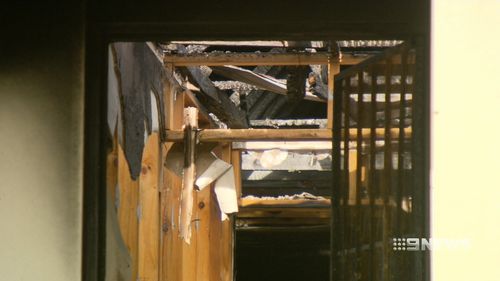 The fire caused the home's roof to collapse. (9NEWS)