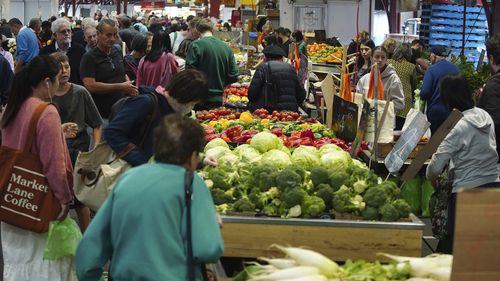 General photo of people shopping for fruits and vegetables at the Queen Vic Market on Friday 2, December 2023. inflation consumer economy