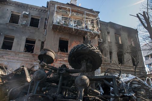 Among the aftermath from shelling in Kharkiv is a car, which has been completely destroyed and a damaged building. 