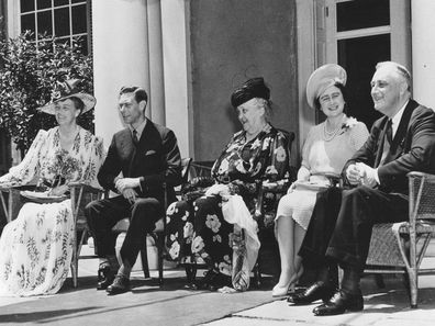 American President Franklin D. Roosevelt (1882 - 1945) (right), his wife, First Lady Eleanor Roosevelt (1884 - 1962) (left), and mother, Sara Roosevelt (1854 - 1941), host King George VI (1865 - 1936) (second left) and his wife, Queen Elizabeth (1900 - 2002), at their home in during a State Visit, Hyde Park, New York, June 11, 1939. (Photo by Photoquest/Getty Images)