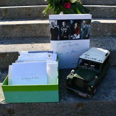 Tributes left for Prince Philip outside various palaces have been moved to Marlborough House Gardens by Royal Parks staff