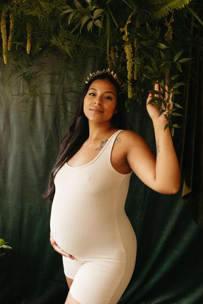 Jennyfer poses while pregnant with Mark Bowness and his husband's child.