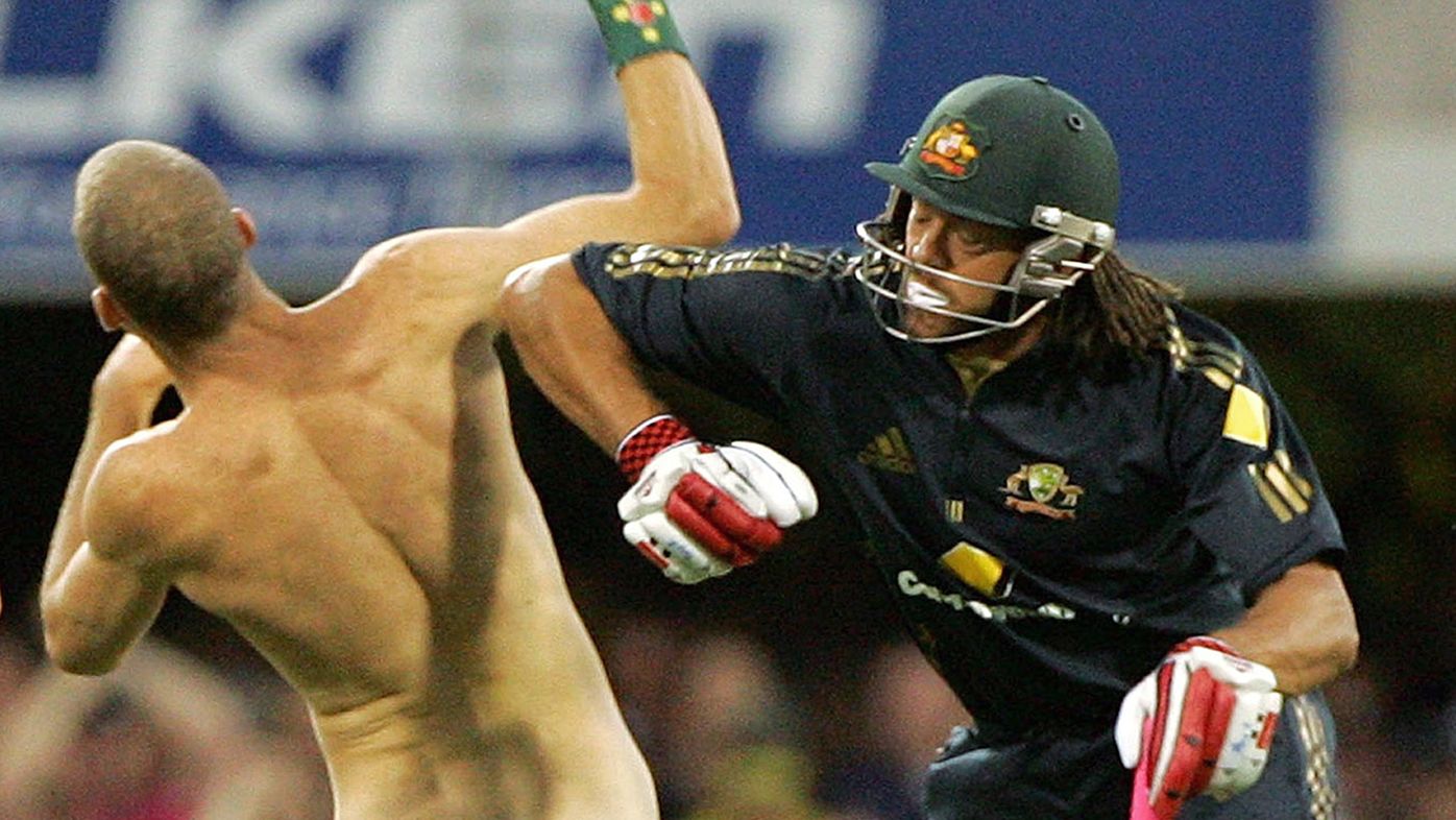 Andrew Symonds knocks over a streaker who ran onto the field during a one-day international between Australia and India at the Gabba on March 4, 2008.