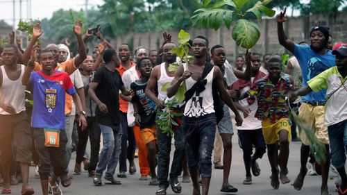 Supporters of opposition presidential candidate Felix Tshisekedi celebrate at his headquarters in Kinshasa.