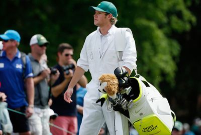 He looked right at home carrying McIlroy's bag.