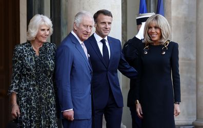 Queen Camilla, King Charles III, French President Emmanuel Macron and Brigitte Macron pose for photographers prior to their meeting at the Elysee Presidential Palace on September 21, 2023 in Paris. 