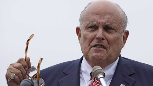 Rudy Giuliani is an associate of the two men arrested at a Washington DC airport.