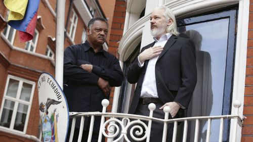 US Reverend Jesse Jackson with Julian Assange on a balcony of the Ecuadorian embassy in London.