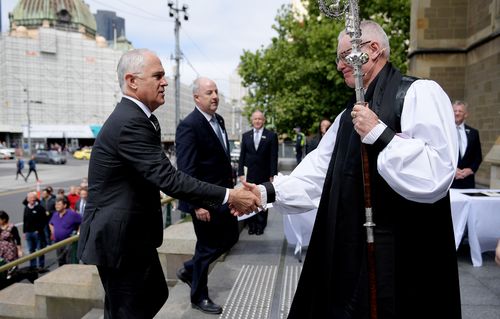 The prime minister Malcolm Turnbull greets Archbishop of Melbourne and Primate of Australia Reverend Dr Philip Freier.