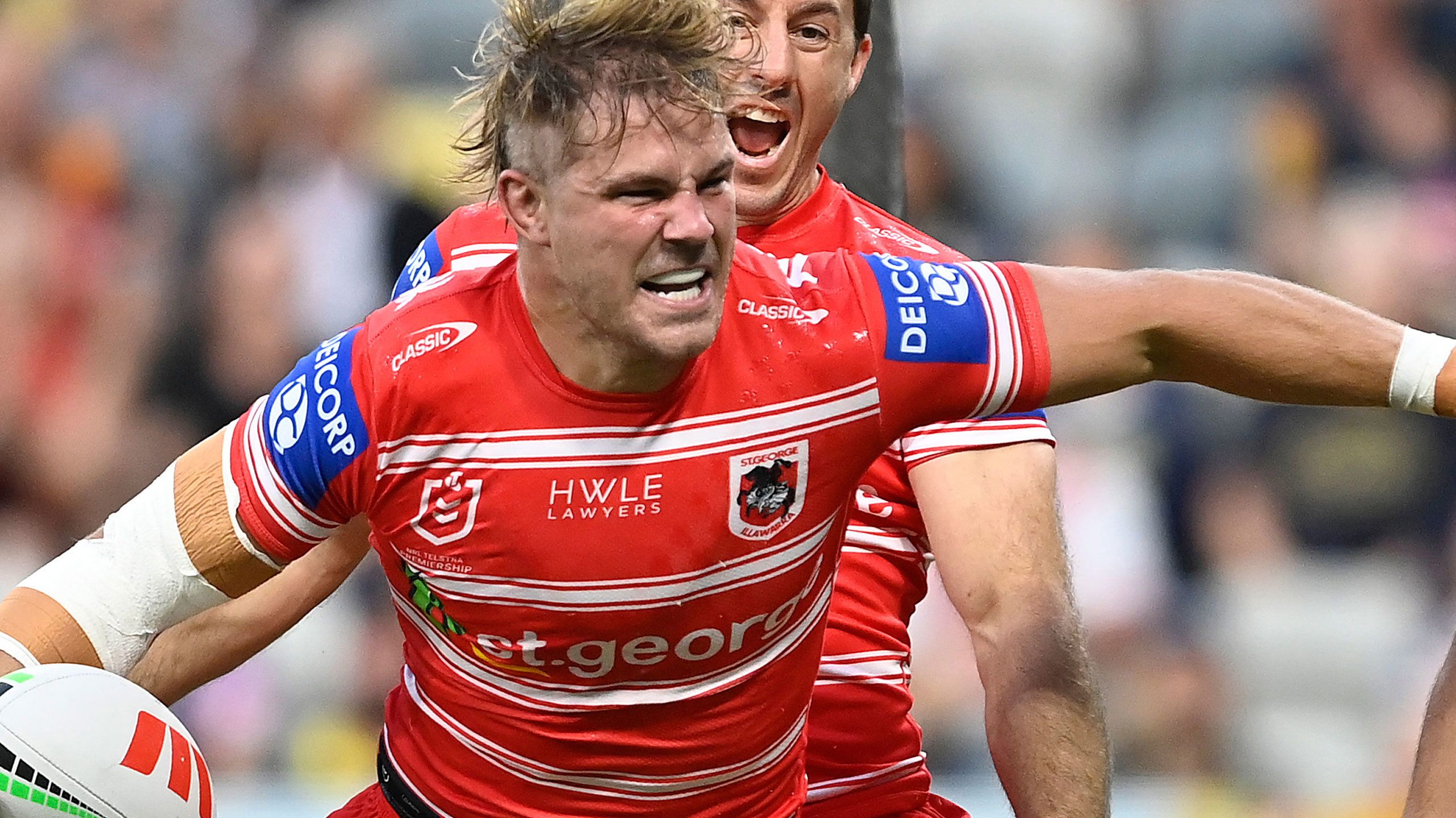 Jack de Belin of the Dragons celebrates after scoring a try  against the North Queensland Cowboys.