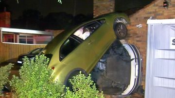 A car slammed through a fence, smashed into a parked van and then burst into flames in Melbourne overnight.