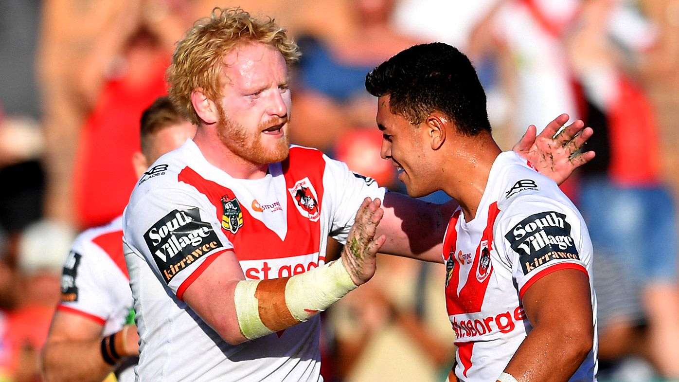 Timoteo Lafai (right) of the Dragons celebrates scoring a try with team mate James Graham