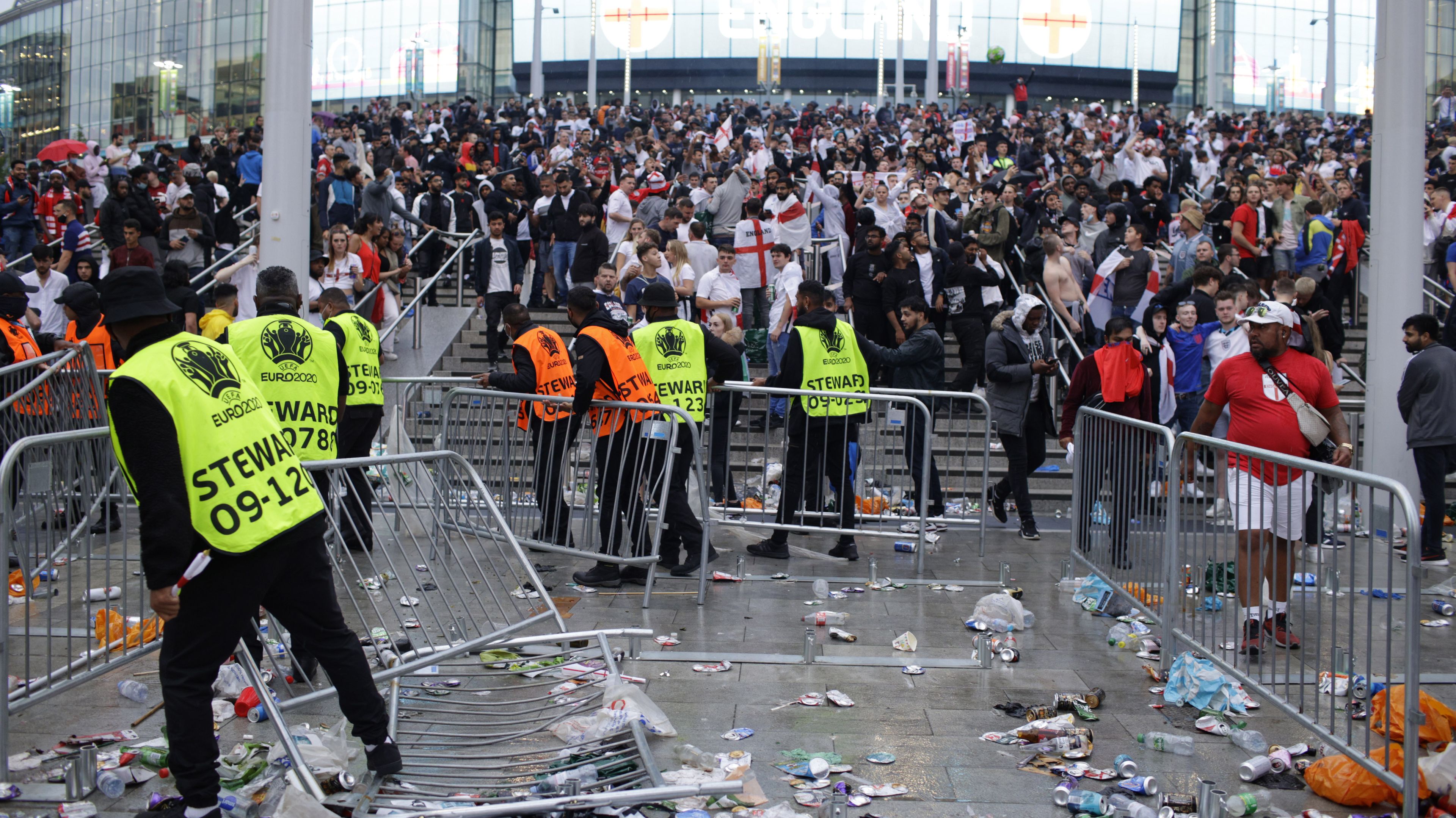 Hundreds of ticketless fans got into Wembley and fought with stewards after areas around the stadium became packed hours before the Euro 2020 final kicked off.