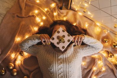 Women with Christmas gift in her hands