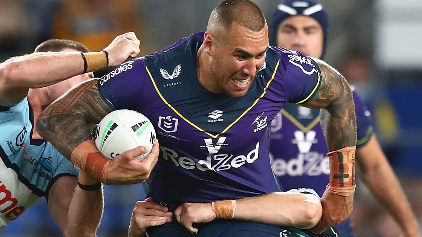 Nelson Asofa-Solomona of the Storm is tackled during the round 25 NRL match against the Cronulla Sharks