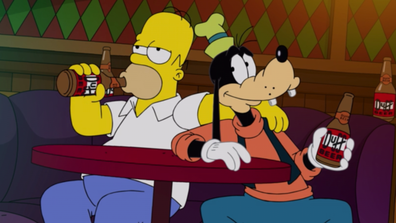 Homer and Goofy share a Duff beer in 'The Simpsons in Plusaversary'.