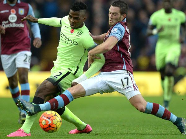 Manchester City's Nigerian striker Kelechi Iheanacho (L) is tackled by Aston Villa's French midfielder Jordan Veretout. (AFP)