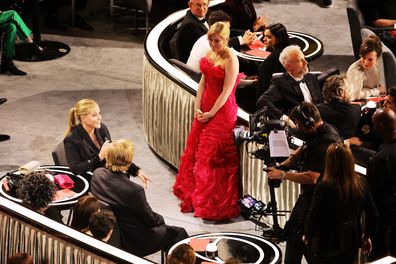 Co-host Amy Schumer, Jesse Plemons, and Kirsten Dunst at the 94th Annual Academy Awards at Dolby Theatre on March 27, 2022 in Hollywood, California.