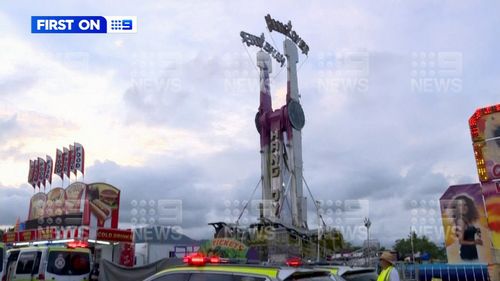 A woman is in a critical condition after falling over 20m from an amusement park ride in Cairns.