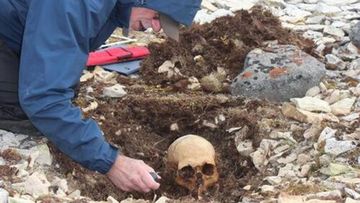 A researcher excavating an unidentified body from the doomed Franklin expedition.