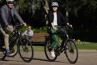 Denmark's Crown Princess Mary rides a bicycle in Sydney, Friday, April 28, 2023.