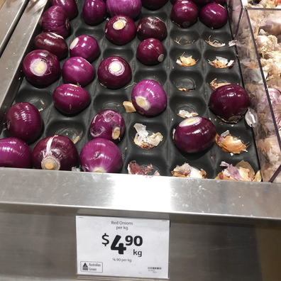 Peeled onions at grocery store