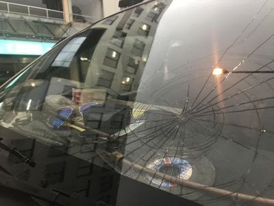 A cracked windshield from hail damage is seen in Sydney city.