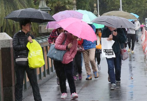 Don't forget your brolly if you're planning to be out and about in Melbourne tomorrow and Friday. (AAP)