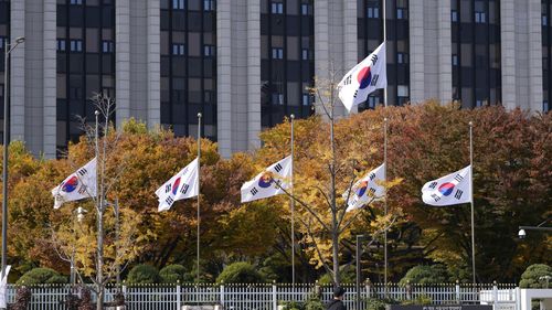 South Korean national flags fly at half-mast at the government complex in Seoul, South Korea.