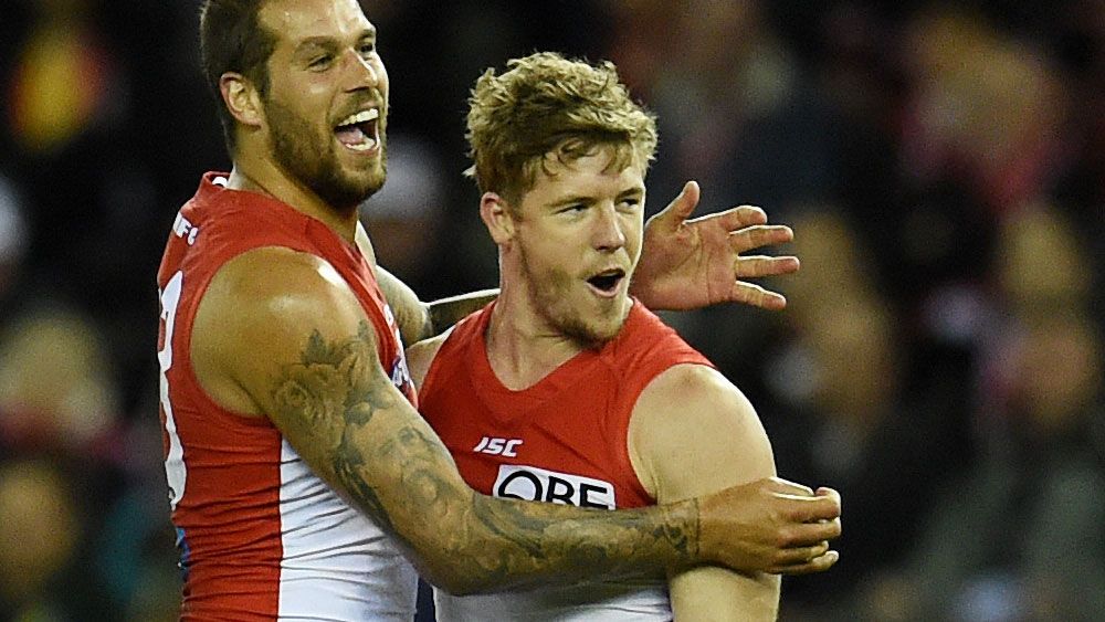 Lance Franklin and Luke Parker in action. (AAP)