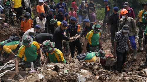 More rescuers and volunteers were deployed Wednesday in devastated areas on Indonesia's main island of Java to search for the dead and missing from an earthquake that killed hundreds of people. (AP Photo/Tatan Syuflana)